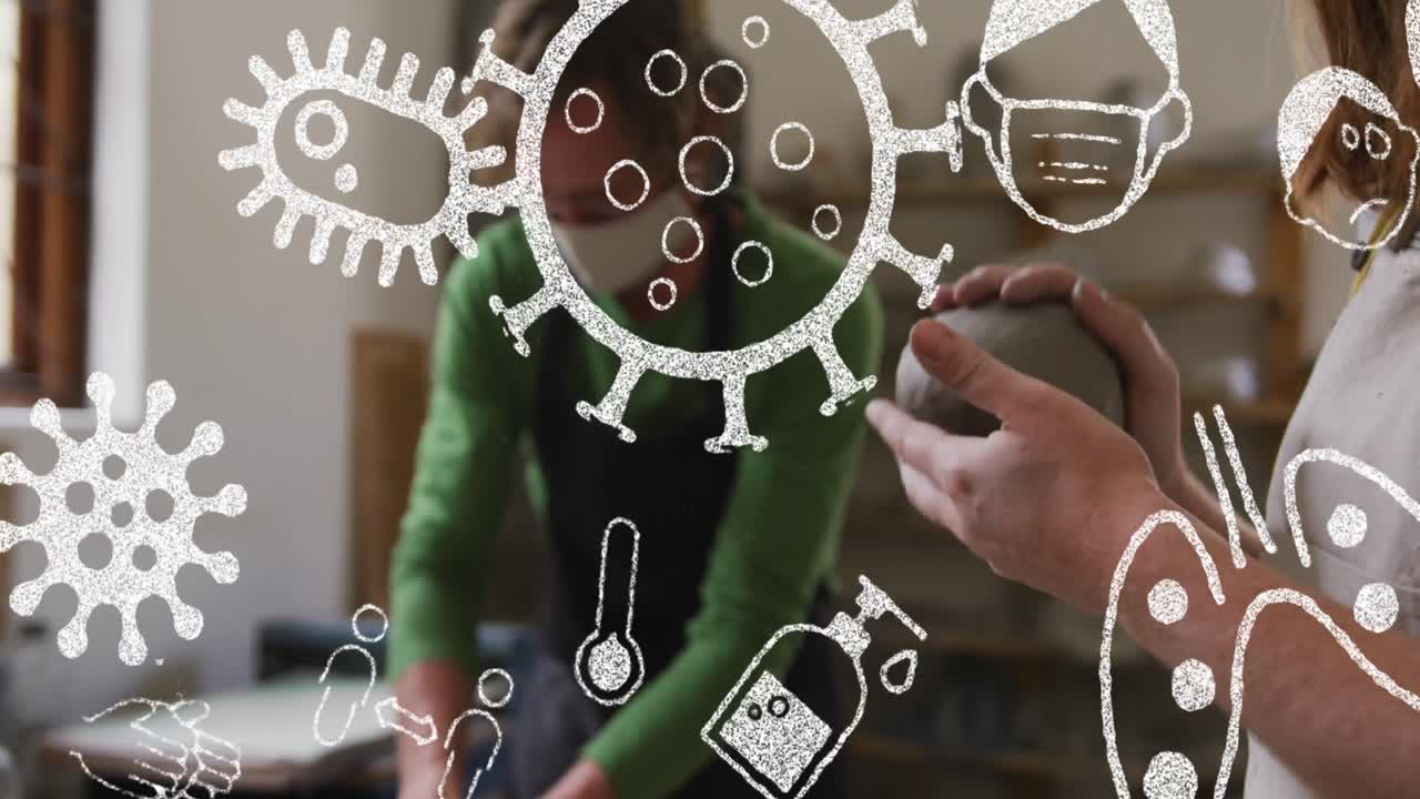 анимация клеток covid-19 и иконок над людьми, носящими маски для лица в керамической мастерской