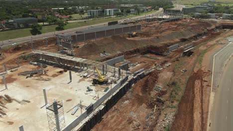 Drone-aerial-of-a-shopping-mall-being-built-earth-works