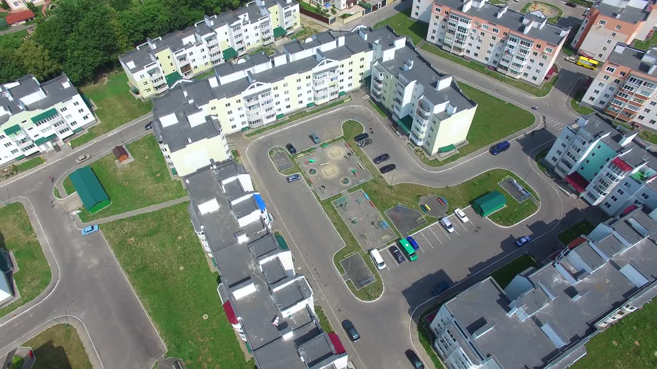 modern buildings with infrastructure in aerial view. Quarter with high-rise buildings is on a green lawn background
