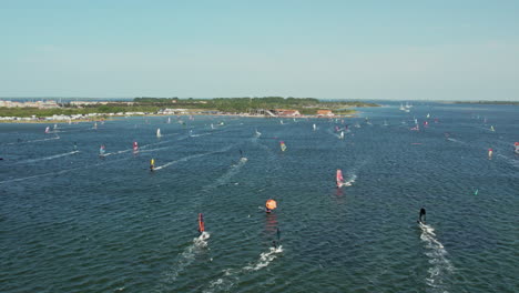 Tourists-Windsurfing-At-The-Surfspot-Of-Grevelingenmeer-At-Brouwershaven,-Schouwen-Duiveland,-Southern-Netherlands