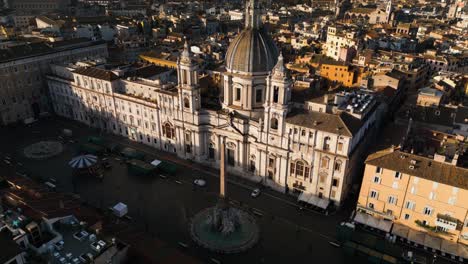 drone ascends above piazza navona, fountain of the four rivers