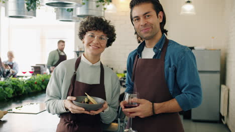 couple of chefs presenting a dish