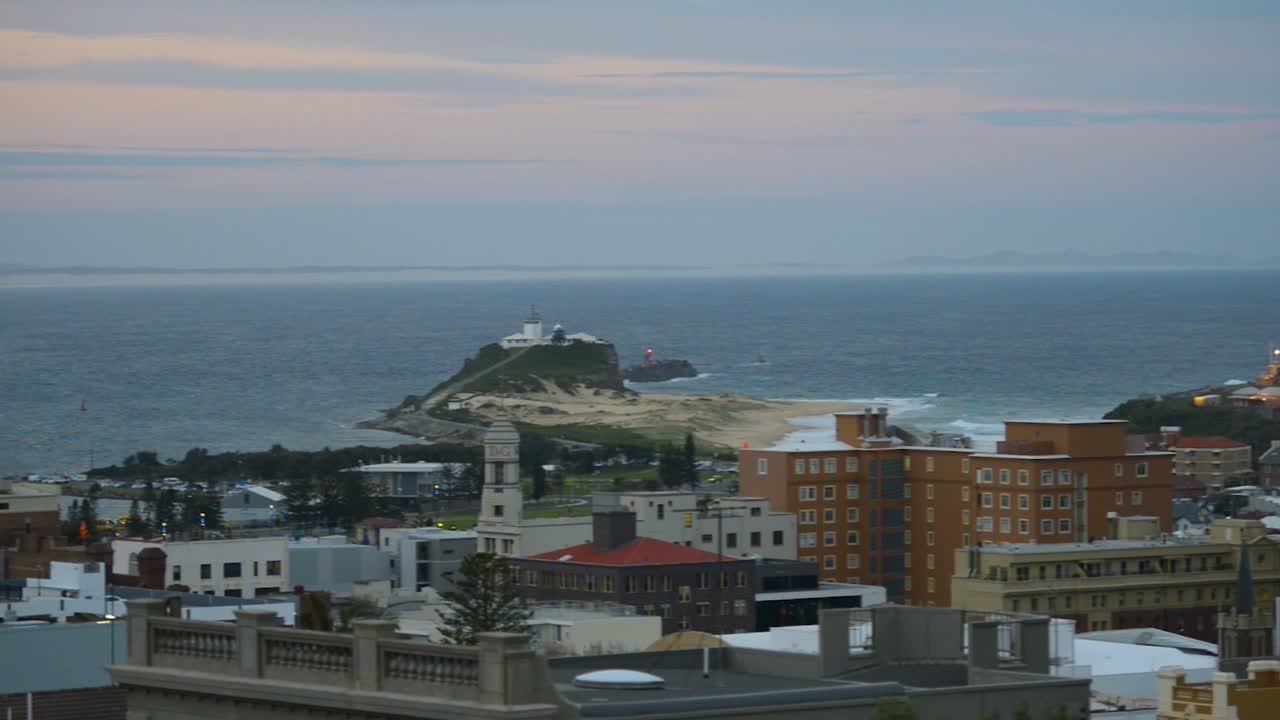 Panning shot of Nobbys Beach, Newcastle, NSW, Australia at sunset