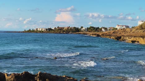 coastline of paphos, cyprus during a blue sky partially cloudy day