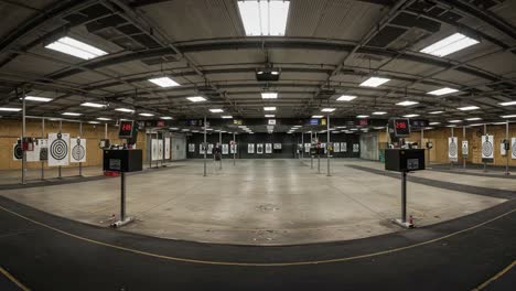 a comprehensive view of a modern indoor shooting range with multiple target sensors and clear target illustrations for precision marksmanship training