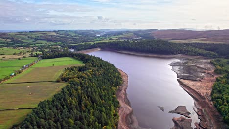 aerial footage moving across the langsett reservoir and the yorkshire countryside