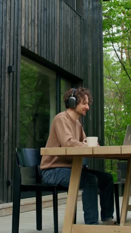 man working from home on a patio