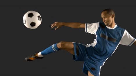 football player kicking the ball