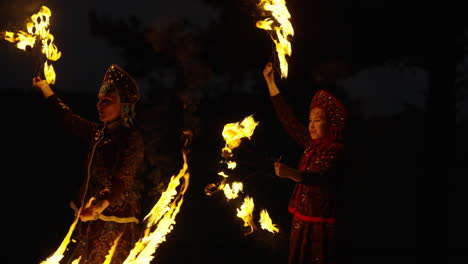 fire dancers in traditional costumes
