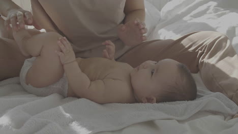 Cute-Baby-With-His-Mommy-In-Bed