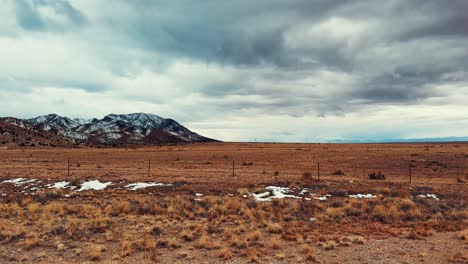 Pan-of-a-cold-desert-with-snowy-mountains