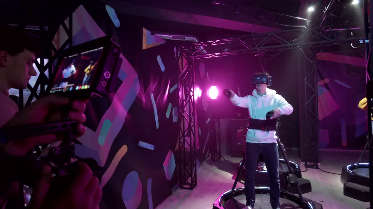 Camera filming a boy playing with a Virtual Reality headset