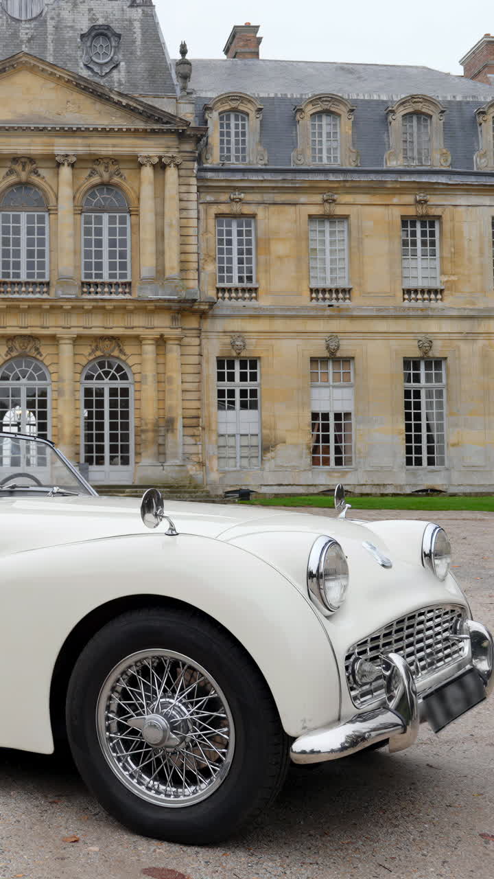 Triumph TR3 in front of a Historic Building