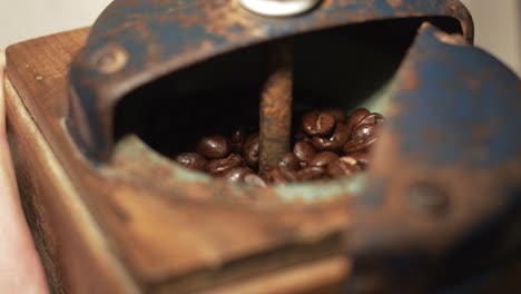 Closeup-manual-coffee-grinder-with-coffee-beans,-JAPY-Grinder-with-sound