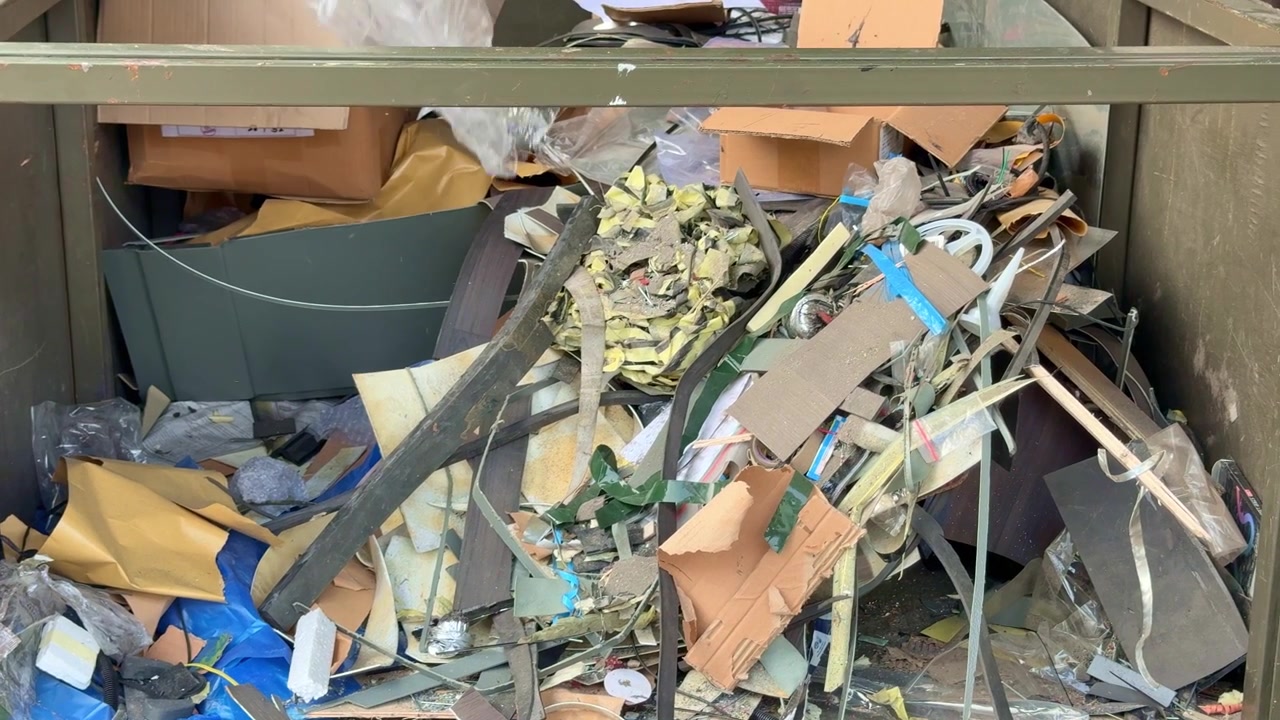 Mixed industrial and household waste sorted for recycling in a waste management facility, supporting circular economy and sustainable resource conservation.