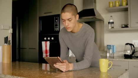 man using digital tablet at home 4k