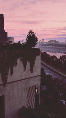 a stunning sunset casts vibrant colors across the sky over an urban riverbank