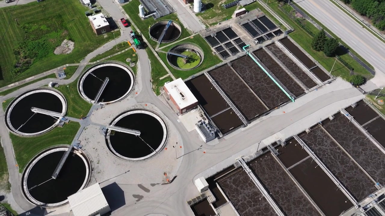 Aerial Pullback Reveals Aeration Basins and Clarifiers at Water Treatment Facility