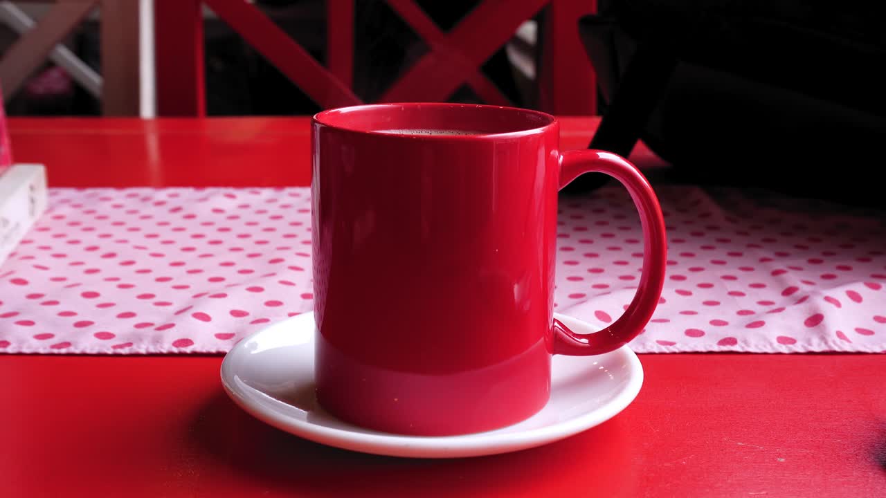 Cup of hot coffee in a coffee shop