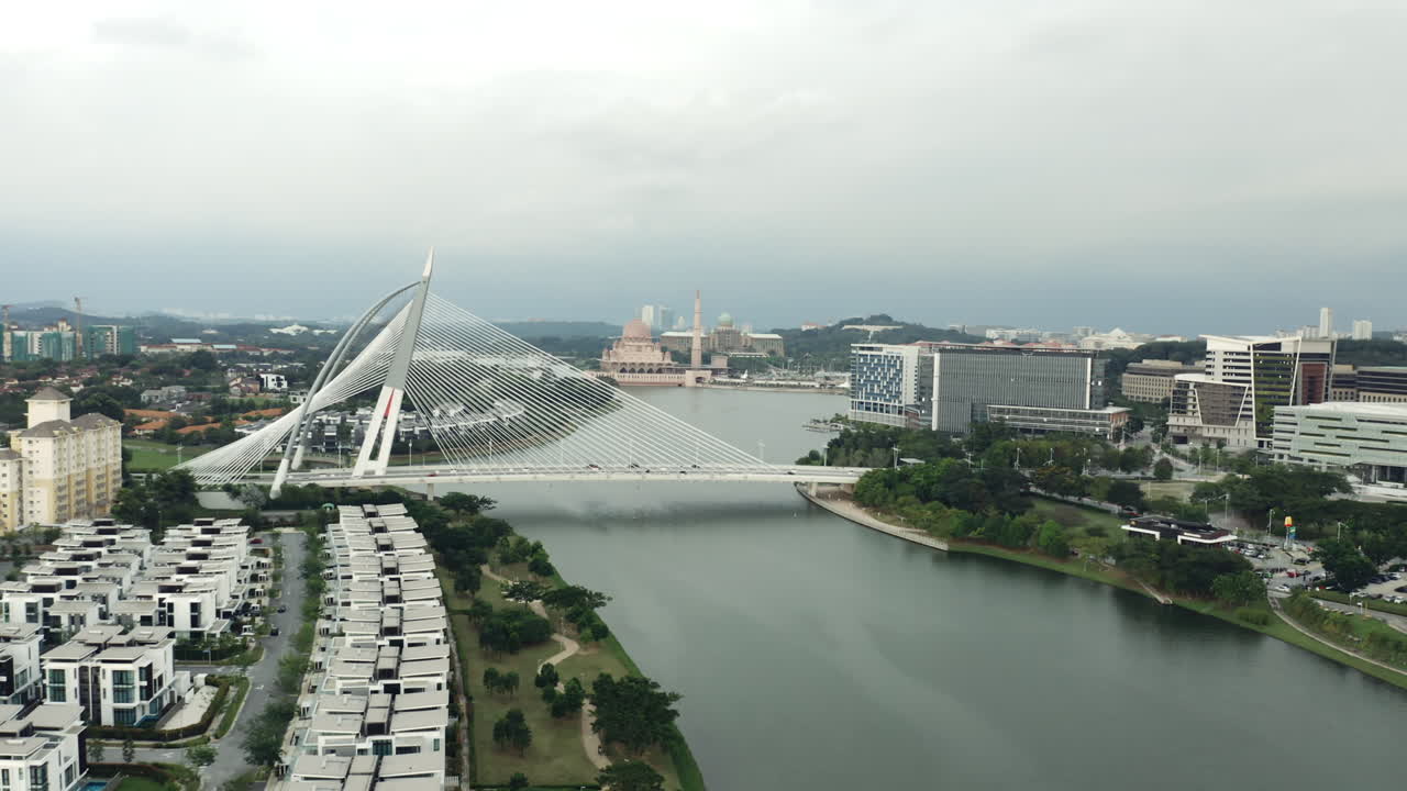 Aerial push-in shot of Seri Wawasan Bridge on cloudy day in Malaysia