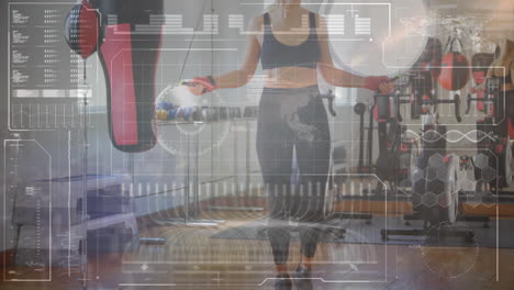 digital interface with data processing against caucasian female boxer jumping ropes at the gym