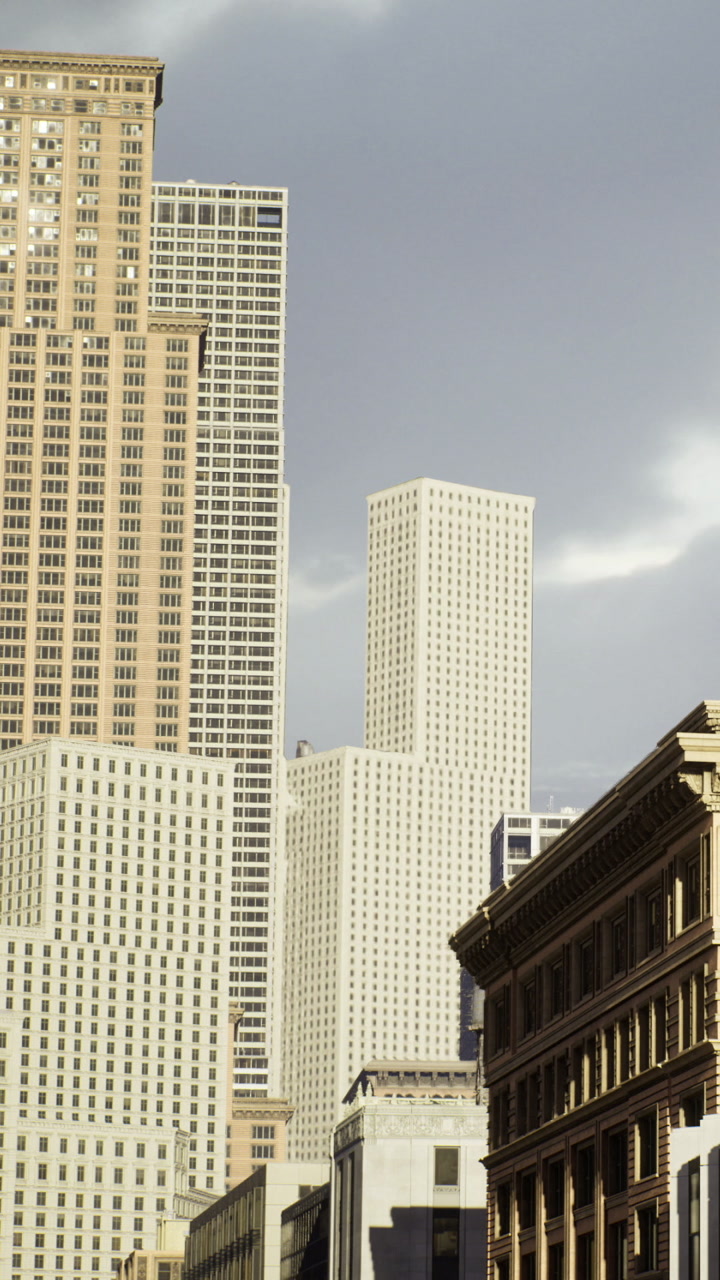 City buildings standing tall under a cloudy sky in an urban area
