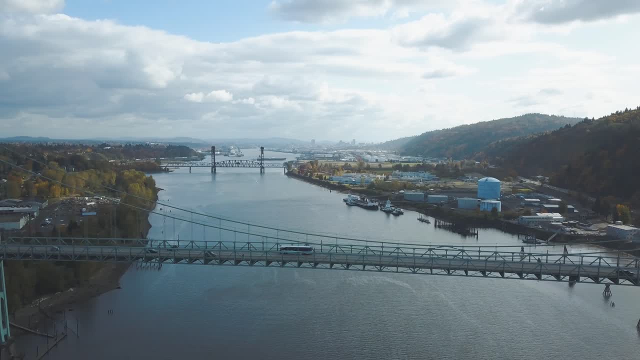 Stunning aerial footage of bus driving over a huge bridge called St. Johns Bridge in Portland - the city of bridges in Oregon, United States of America