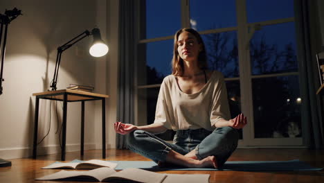 woman meditating at night