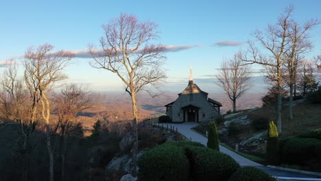 picturesque chapel on side of mountain, glassy mountain chapel, glassy cliffs, landrum, sc