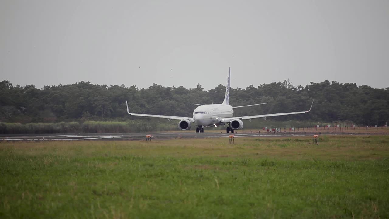 Airplane (aircraft) is taxiing on a taxiway before takes off (taking off) at sunset