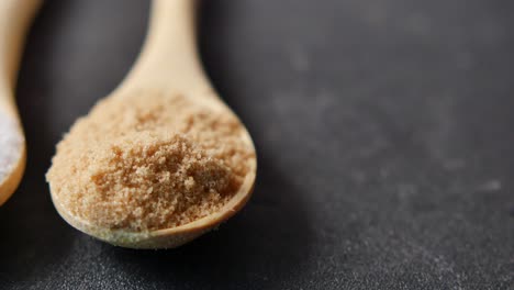 Comparing-white-and-brown-sugar-on-table-,