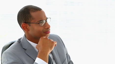 Businessman-thinking-at-his-desk