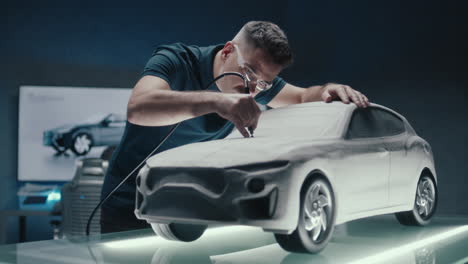 car model design and sculpting in a modern studio