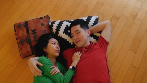 couple relaxing on floor in living room