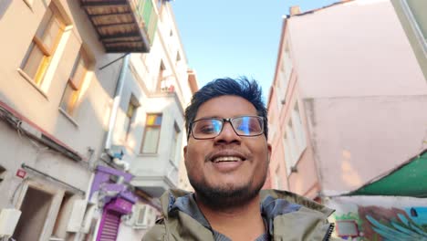 smiling man in a city street