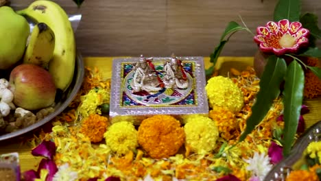 hindu god religious ritual festive pray with flowers from flat angle