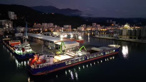 A-video-capturing-the-enchanting-reflection-of-the-dancing-lights-of-the-ships-waiting-in-the-harbor-on-the-sea-surface