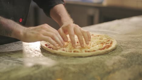 chef preparing a pizza