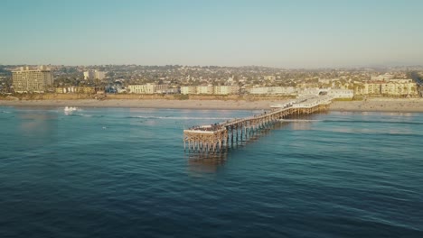 aerial view of the "crystal pier" or "pacific beach pier" in san diego california on a warm and sunny day with blue sky at pacific beach - 4k