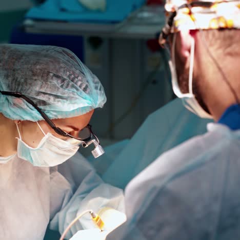 surgeon and his assistant performing cosmetic surgery. abdominoplasty plastic surgery. body correction