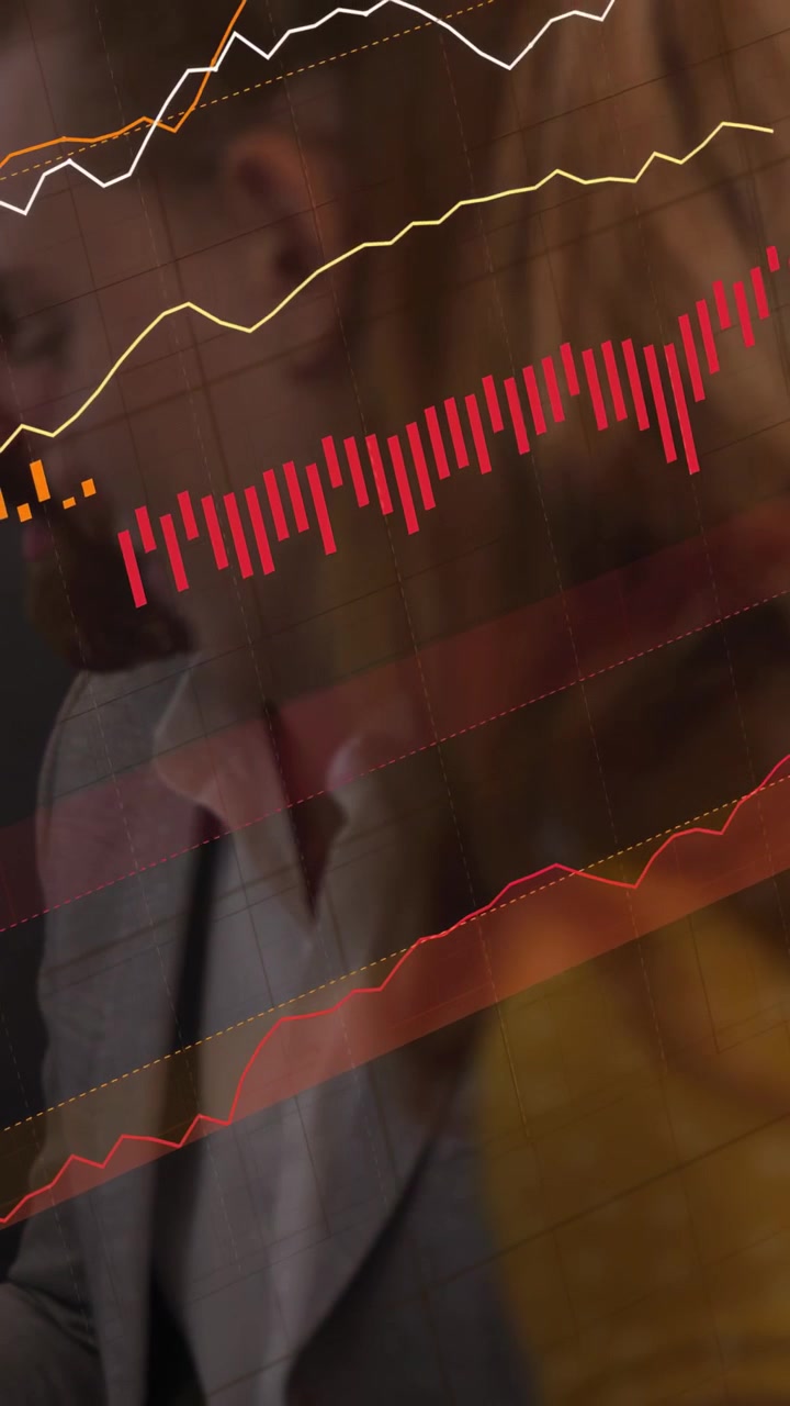 Vertical video: Team leaning, watching red bars expanding into lines overlaying faces for finance