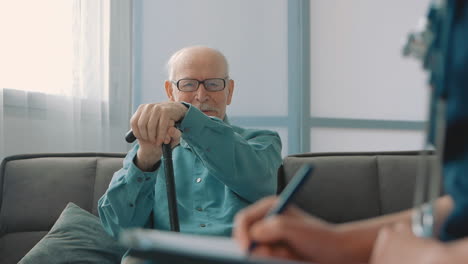 ederly man with cane in the nursing home