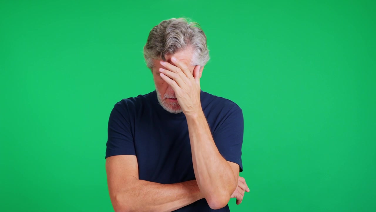 Senior Man Coughing and Feeling Unwell Against Green Screen