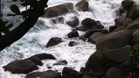 powerful ocean waves crashing on rocky shore