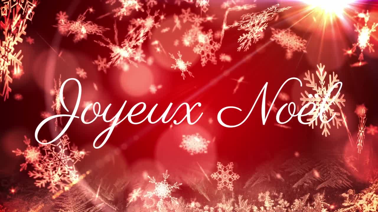 Animazione del testo 'Joyeux Noël' su sfondo rosso con neve che cade.
