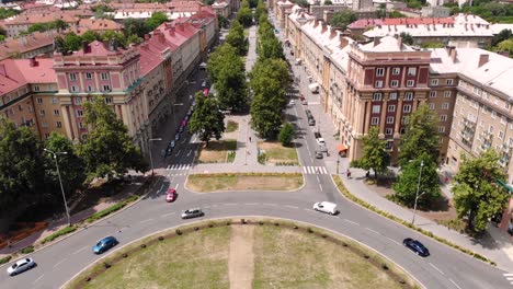 Hlavni-Trida-street-roundabout-aerial-fly-backward-promenade-of-Poruba-reveal-shot,-Ostrava,-Czechia