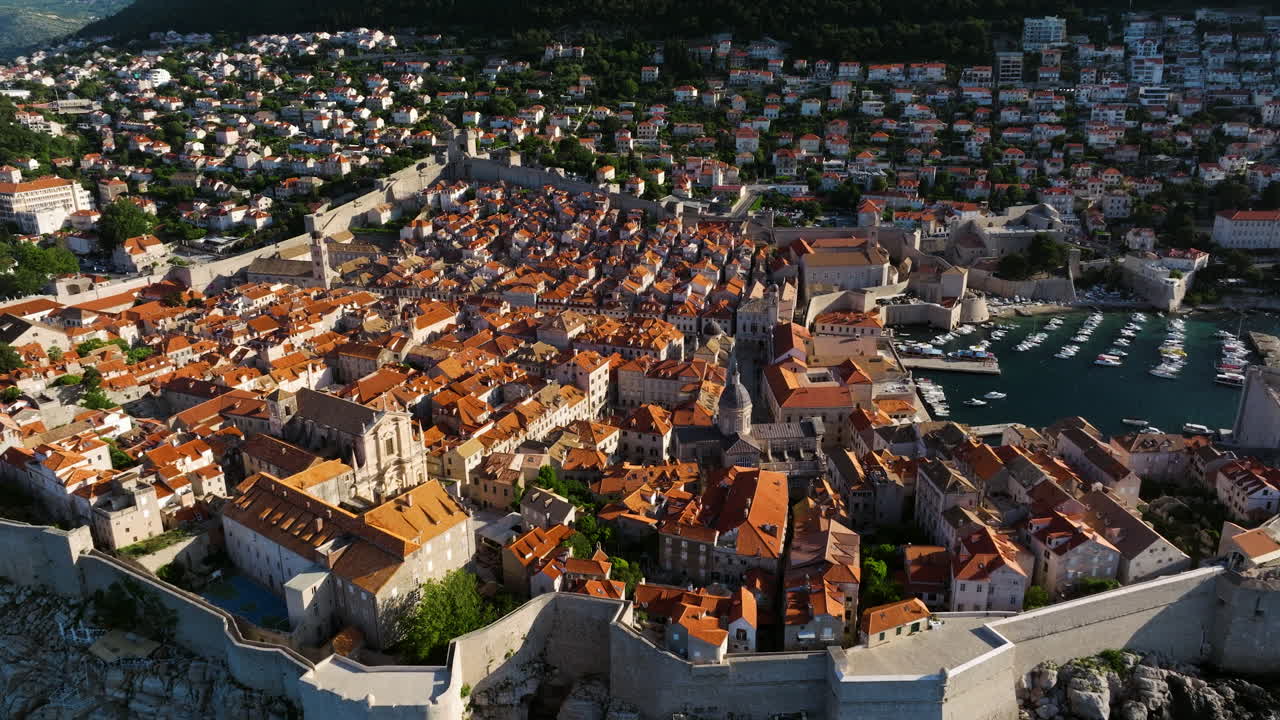 Old Town And City Walls of Dubrovnik In Dalmatia, Croatia. - aerial shot
