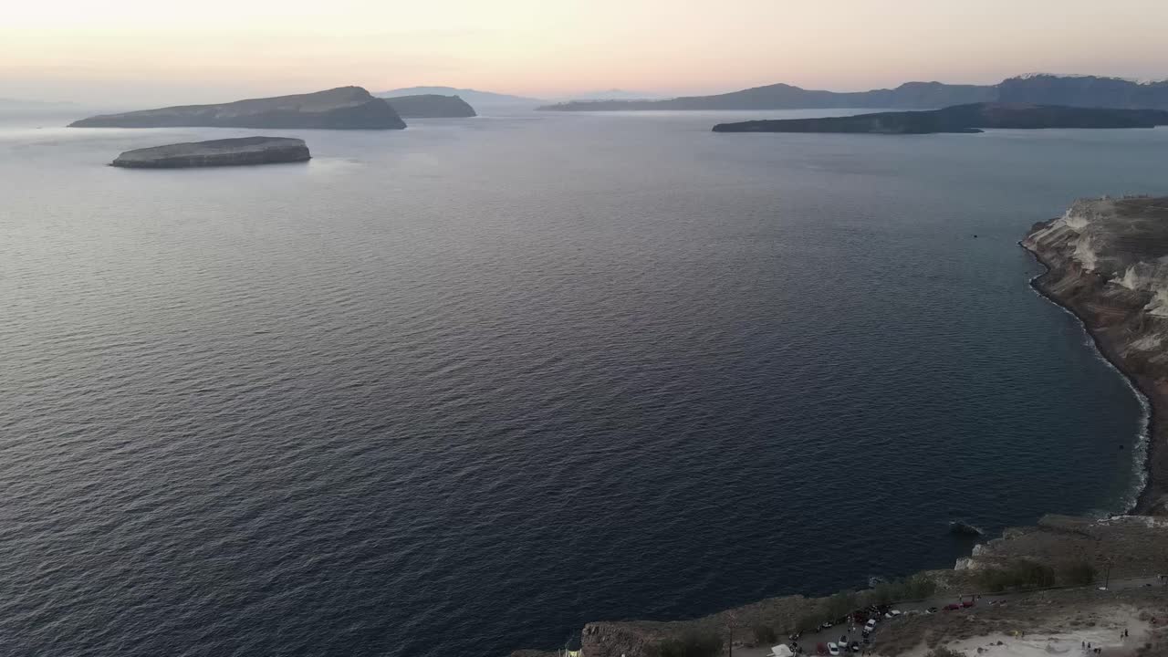 Stunning aerial view of the volcanic caldera of Santorini island during sunset