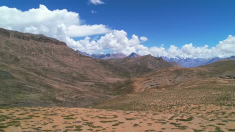 dolly-pan-right-of-beautiful-dry-landscape-in-the-Himalayan-mountains-of-Spiti-Valley-India,-aerial