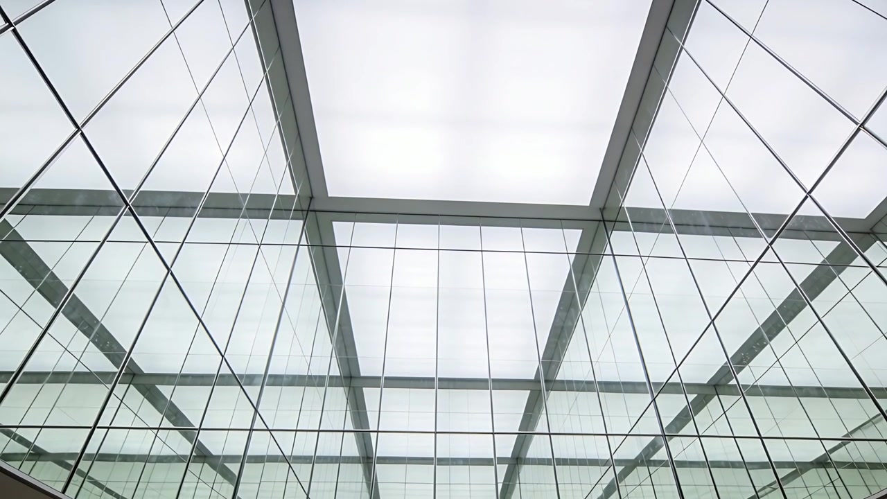 Framing atrium ceiling, camera tilting and drifting in lobby, showing frosted skylight and mullions